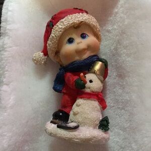 Festive Child and Snowman Figurine